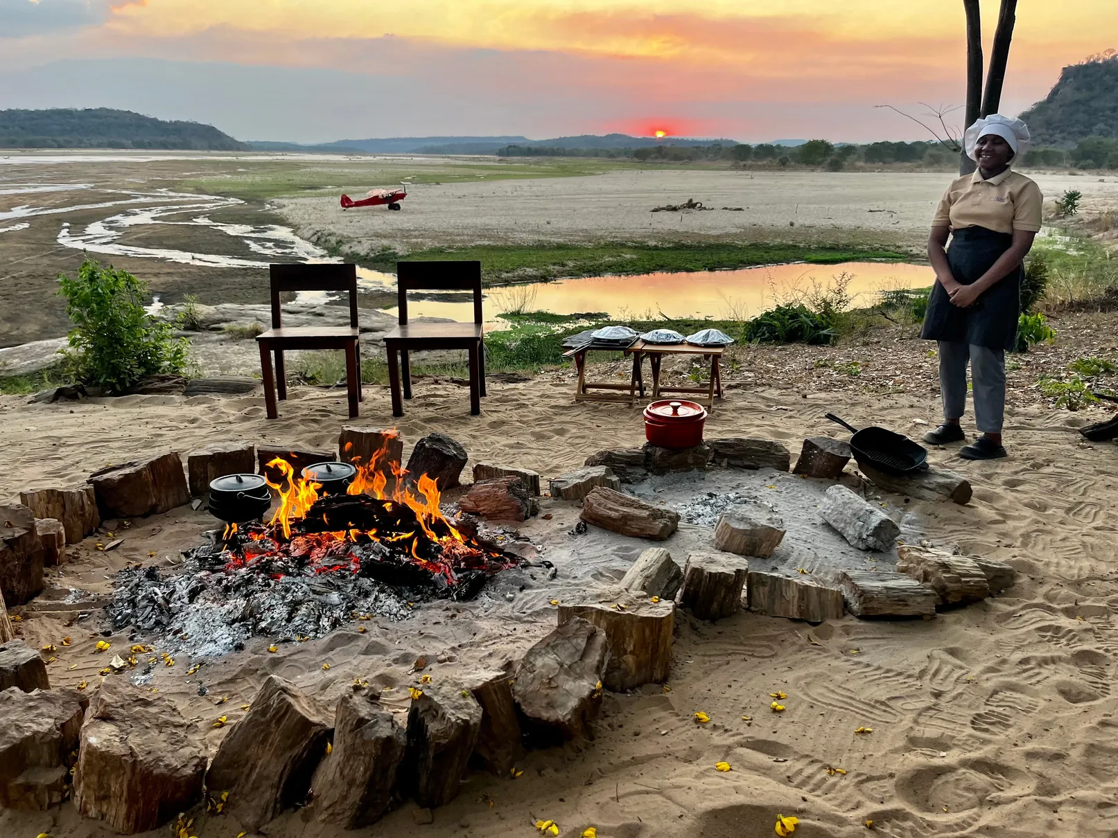 Campfire overlooking the valley at sunset